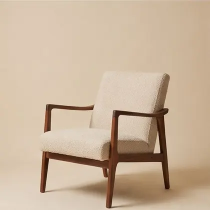 Walnut-framed lounge chair in oatmeal bouclé, rotated 45 degrees.