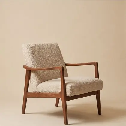Walnut-framed lounge chair in oatmeal bouclé, rotated 135 degrees.