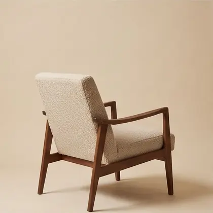 Walnut-framed lounge chair in oatmeal bouclé, rotated 270 degrees.