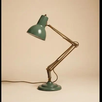 Brass and sage enamel articulated desk lamp, rotated 315 degrees.